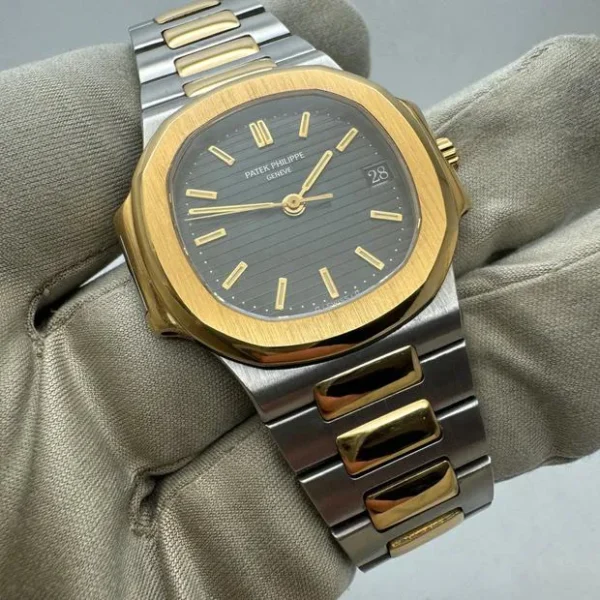 Patek Philippe Nautilus - Elegant Timepiece with Black and Gold Dial - Image 3