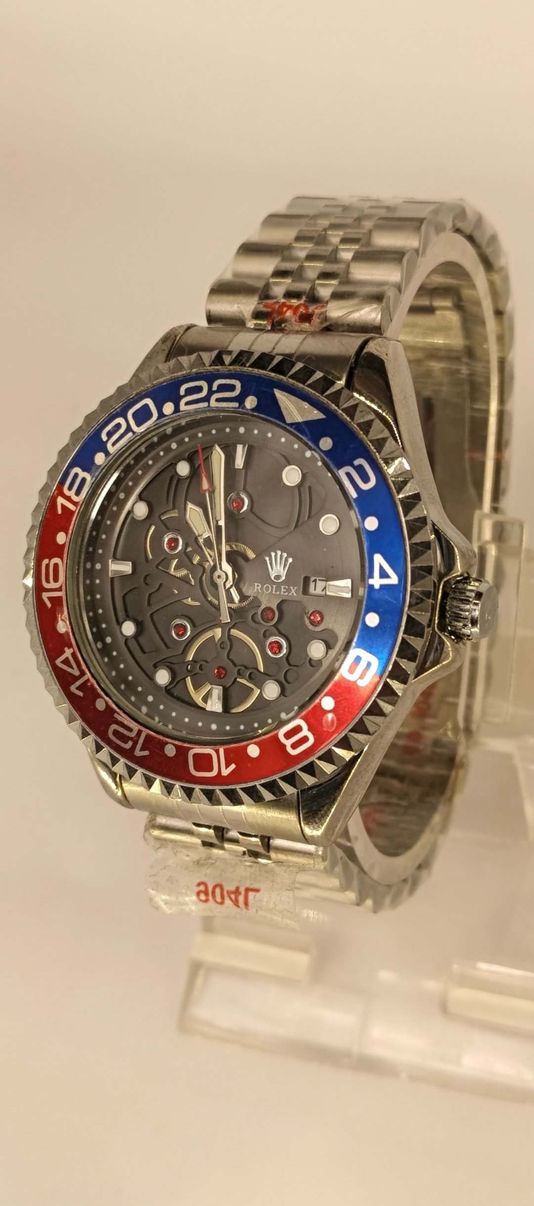 Rolex Stylish Mechanical Skeleton Watch with Red and Blue Bezel - Image 3