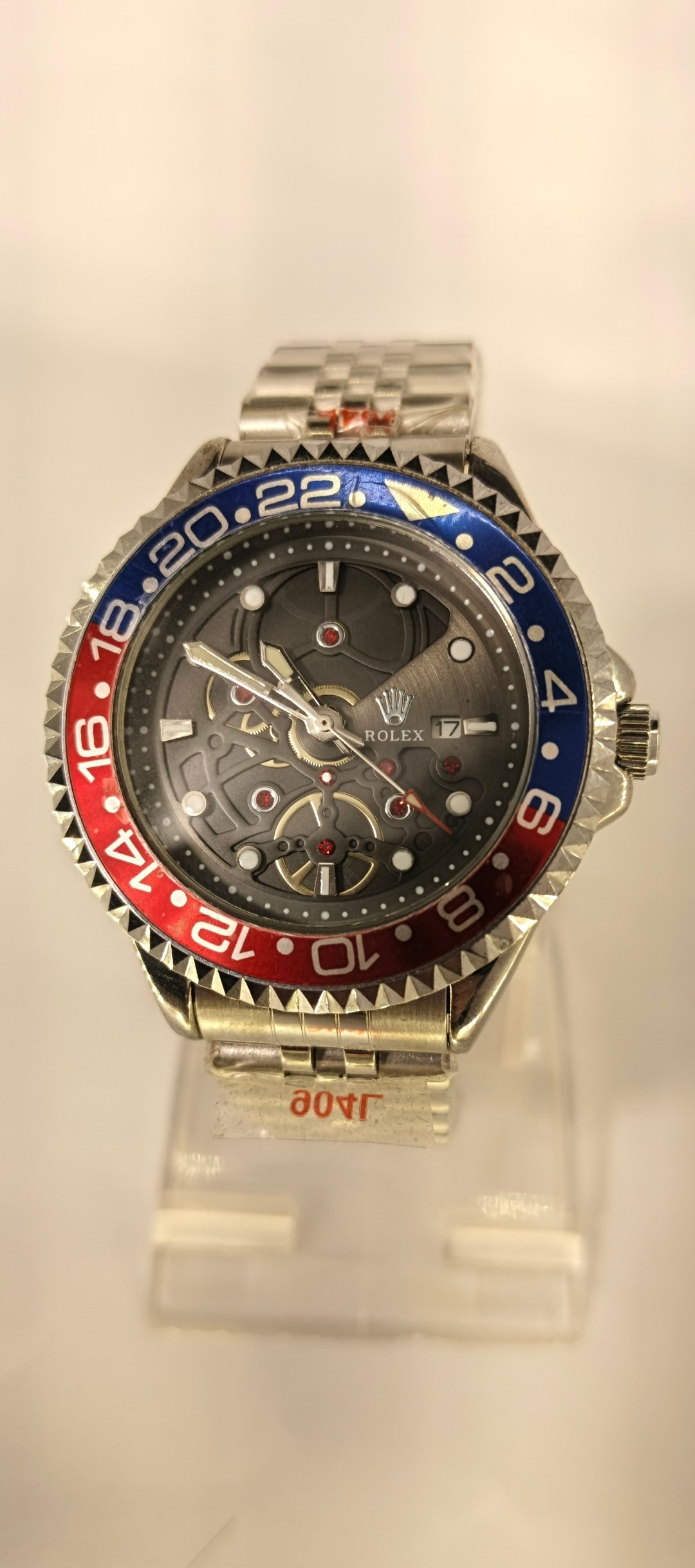 Rolex Stylish Mechanical Skeleton Watch with Red and Blue Bezel - Image 4
